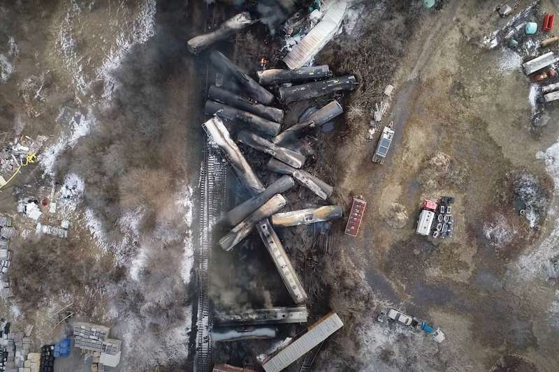 A jumble of train cars in a wreck, seen from above.